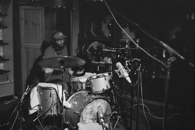 2026-04-09 Lucas Kolbe & Tommy Crane: in motian. a man on drums; several microphones in the foreground