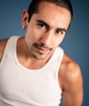 Portrait photo of Esteban Romo Salcedo Portrait photo of a man with short black hair.