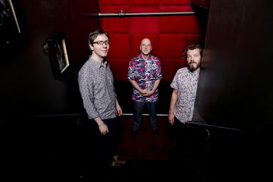Group photo of three men from above