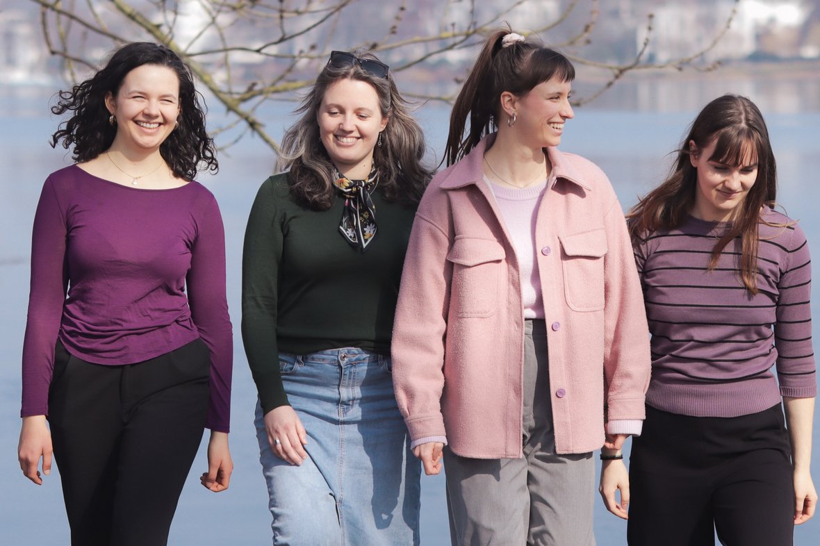 Feminale Team Four women—the Feminale team—walk toward the camera outdoors.