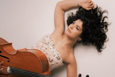 The artist lying down with cello