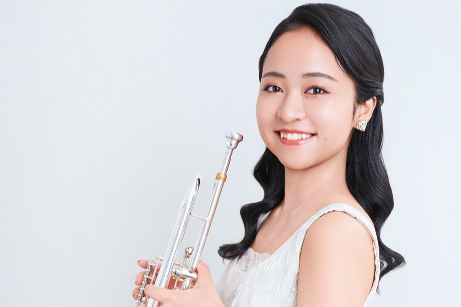 Lisa Mimura Musician with trumpet in hand, laughing