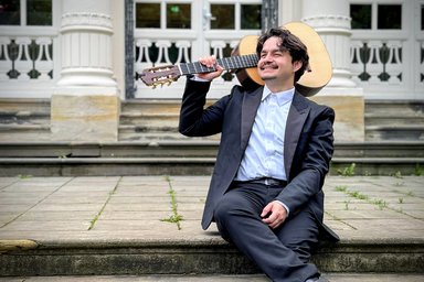 Amjad Giraldo with guitar